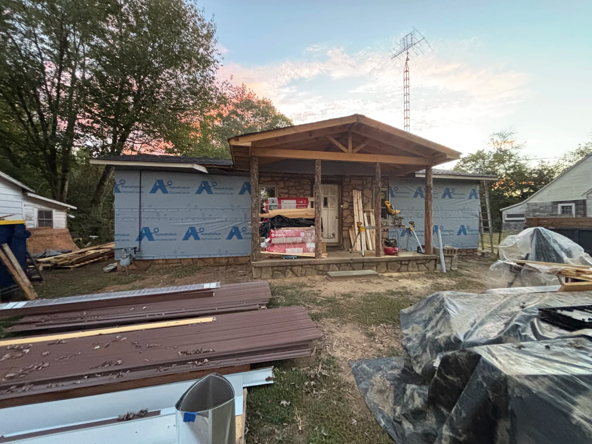 Gallery photos for Old Wood Siding Replaced With Clean Metal Panel Finish: Image #2