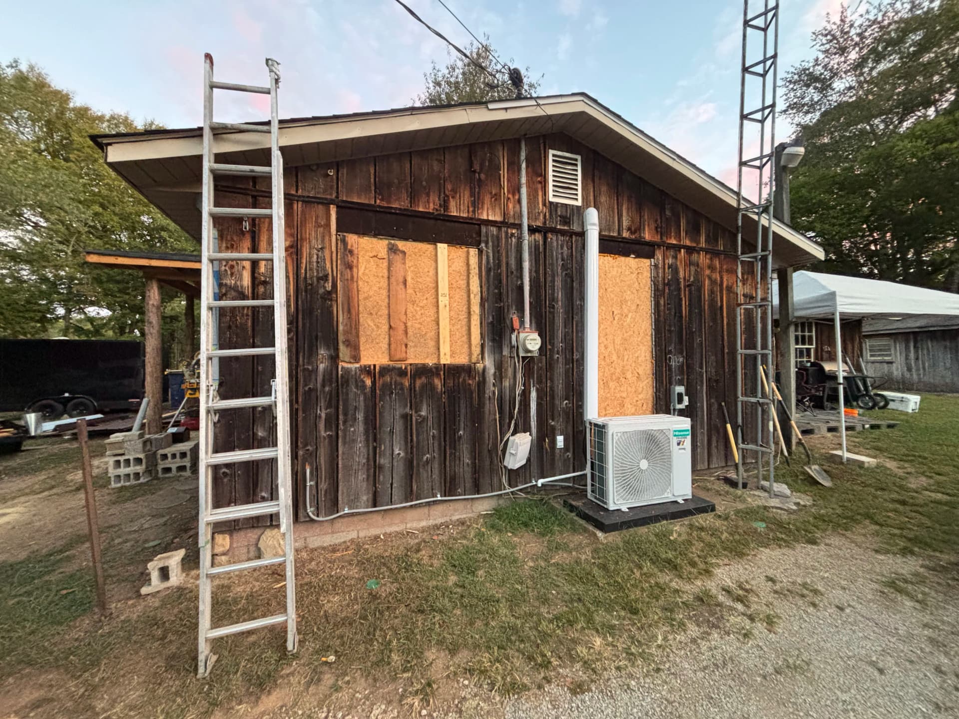 Gallery photos for Old Wood Siding Replaced With Clean Metal Panel Finish: Image #1