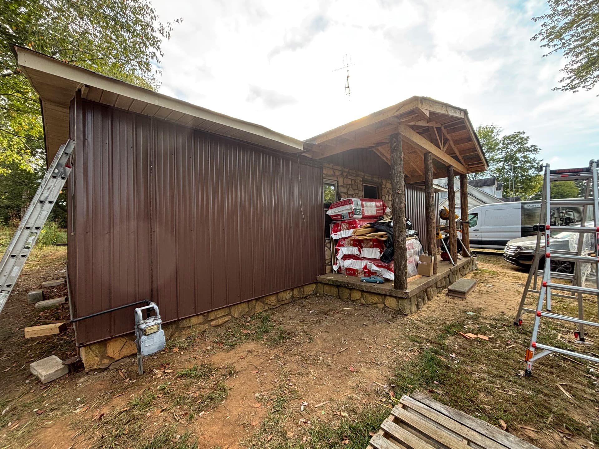 Gallery photos for Old Wood Siding Replaced With Clean Metal Panel Finish: Image #9