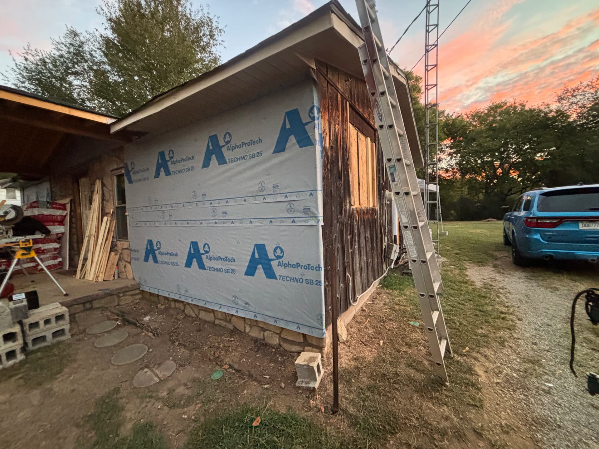 Old Wood Siding Replaced With Clean Metal Panel Finish image