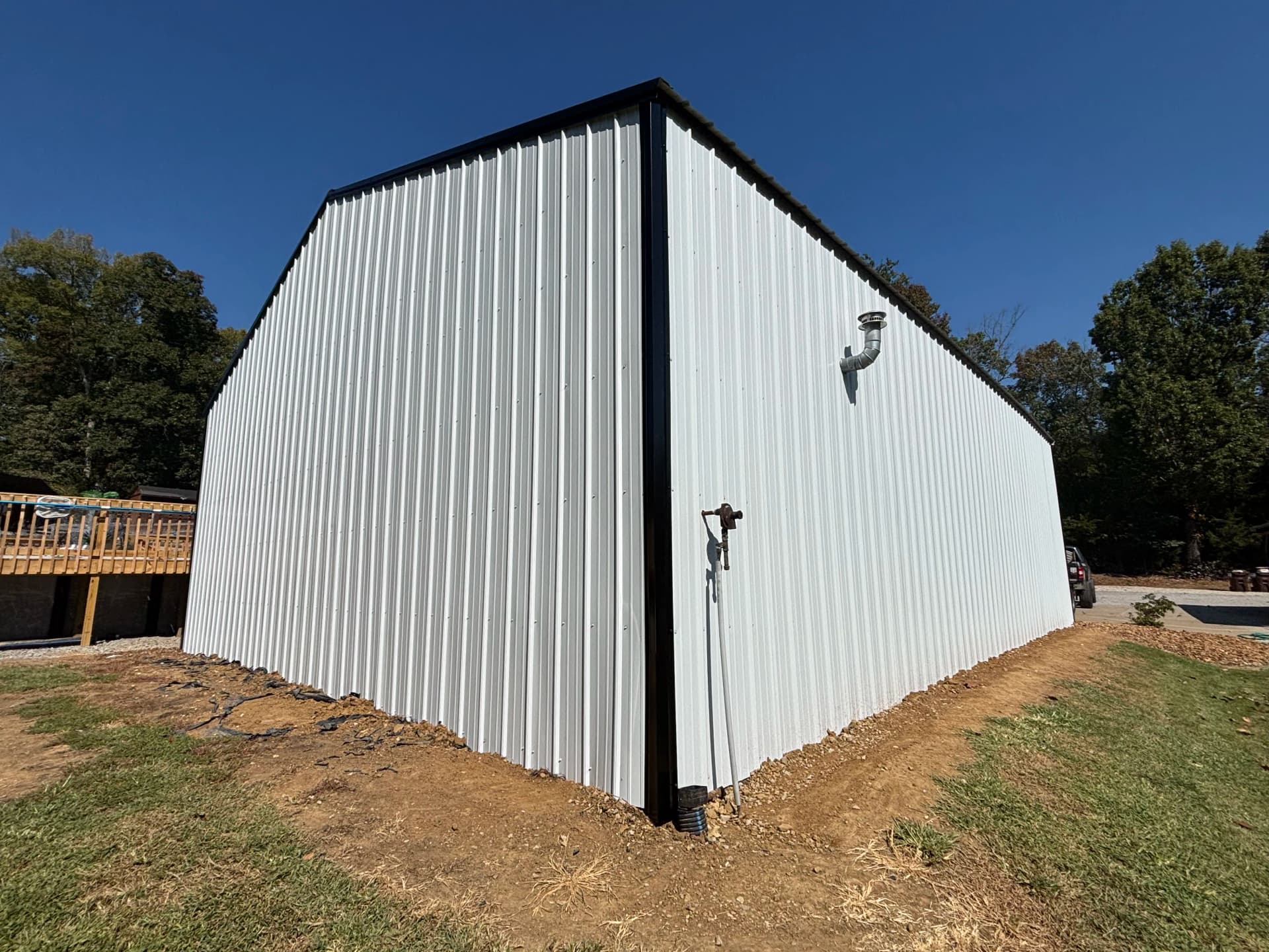 Shop Gets a Full Metal Siding Overhaul - White, Black Trim, Black Roof image